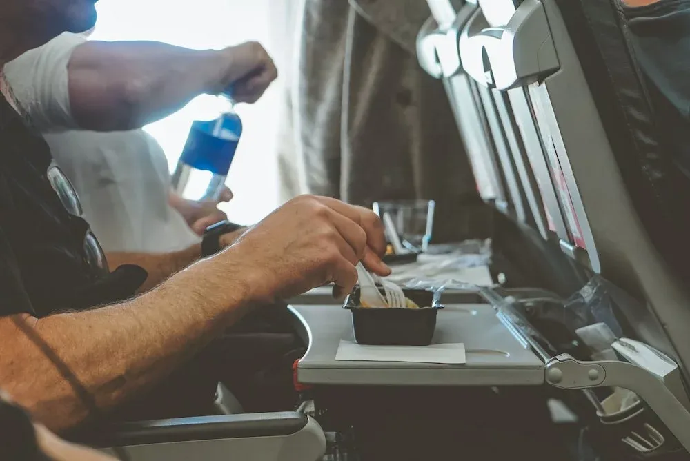 Meal service on planes is always a highlight. Indulge!