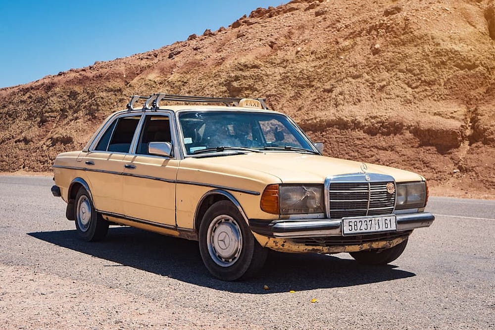 While there are more modern grand taxis, some are still ageing, cream coloured Mercedes like this one