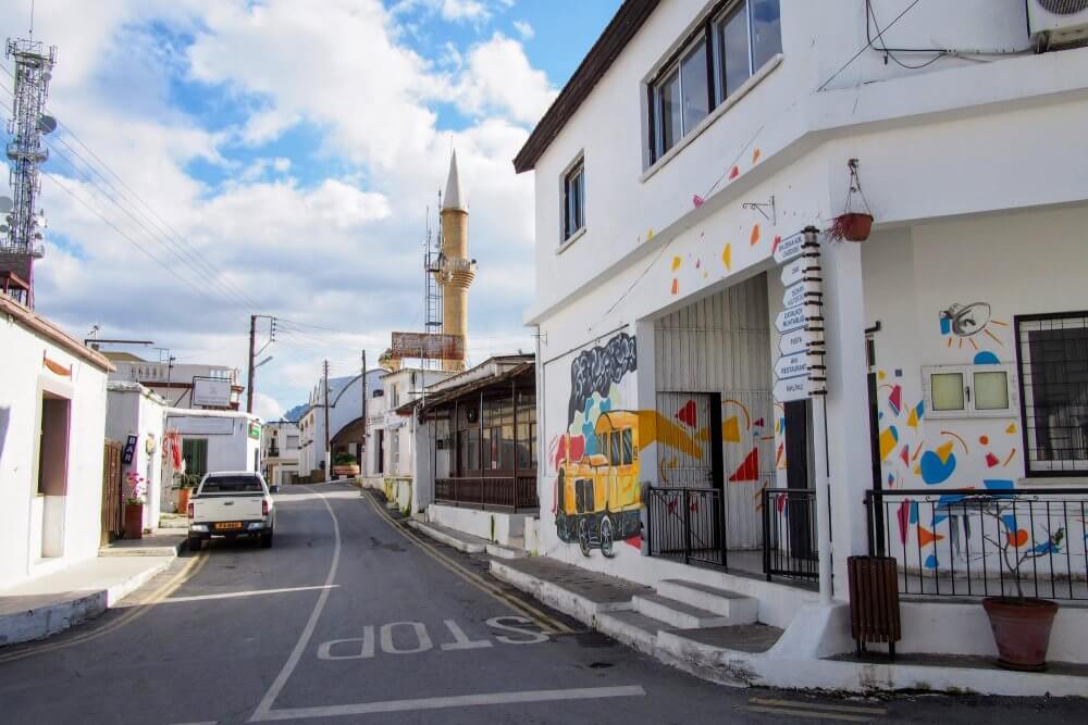 Road signs (right) show destinations in Turkish only in the village of Çatalköy, near Kyrenia/Girne.