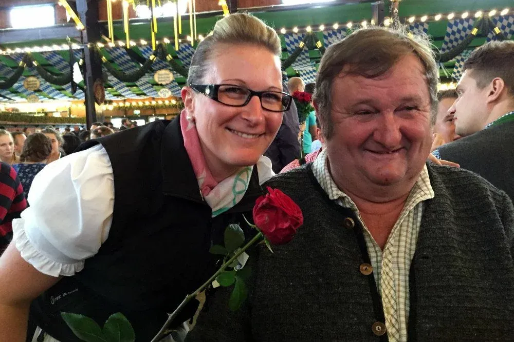 Andrew, our Oktoberfest friend, buys a rose for our server