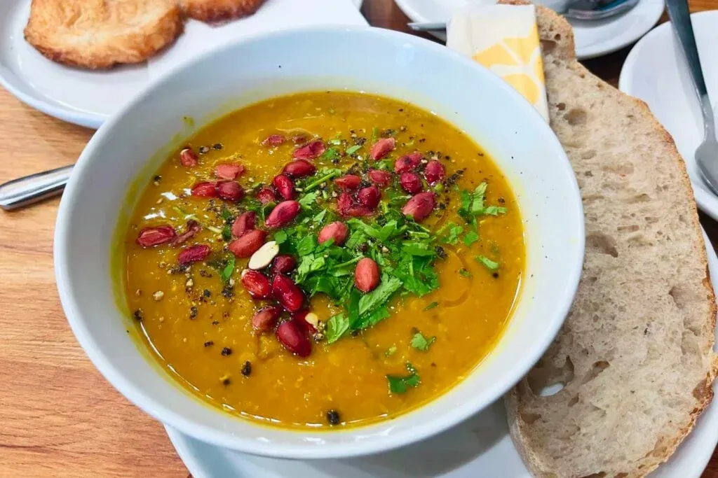 A bowl of Xoko’s soup of the day along with a slice of their sourdough.